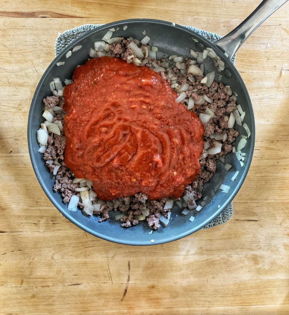 cooked ground beef, onion, garlic, and spaghetti sauce in a large skillet