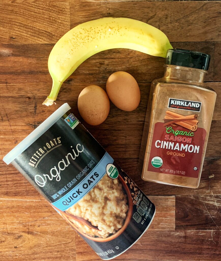 Oats, banana, two eggs, cinnamon on counter top