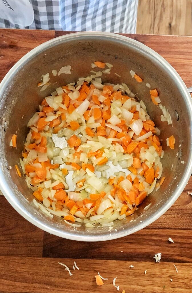 sautéd carrots and onions in large soup pot