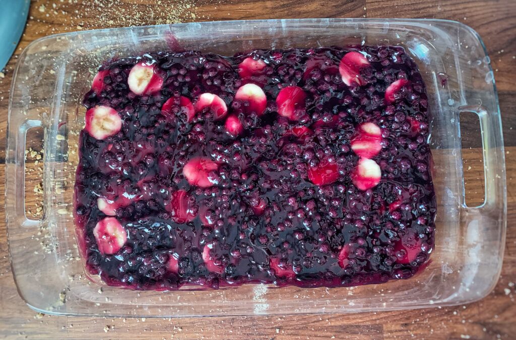 blueberry pie filling in glass pan