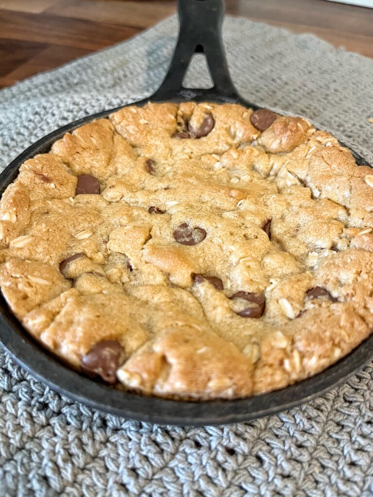 chocolate chip pizookie baked in mini cast iron on counter