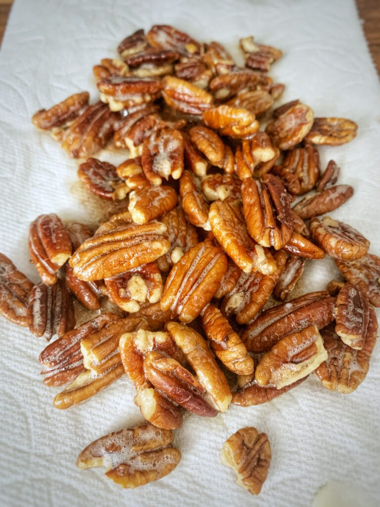 roasted pecans on paper towel