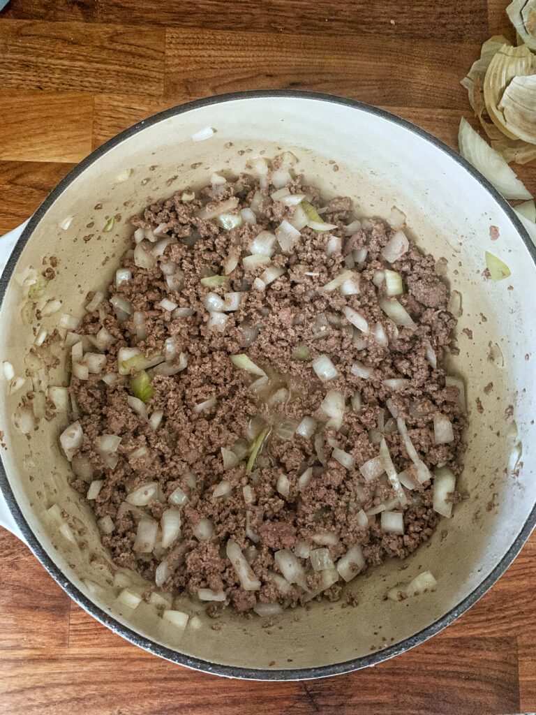 Ground beef and onion in soup pot