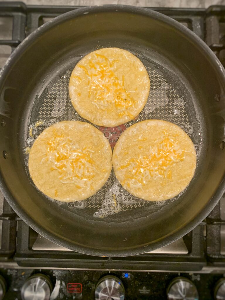 tortillas frying with cheese