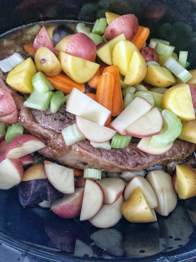 veggies on roast in slow cooker