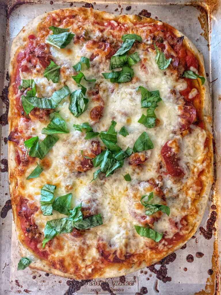 pizza topped with basil