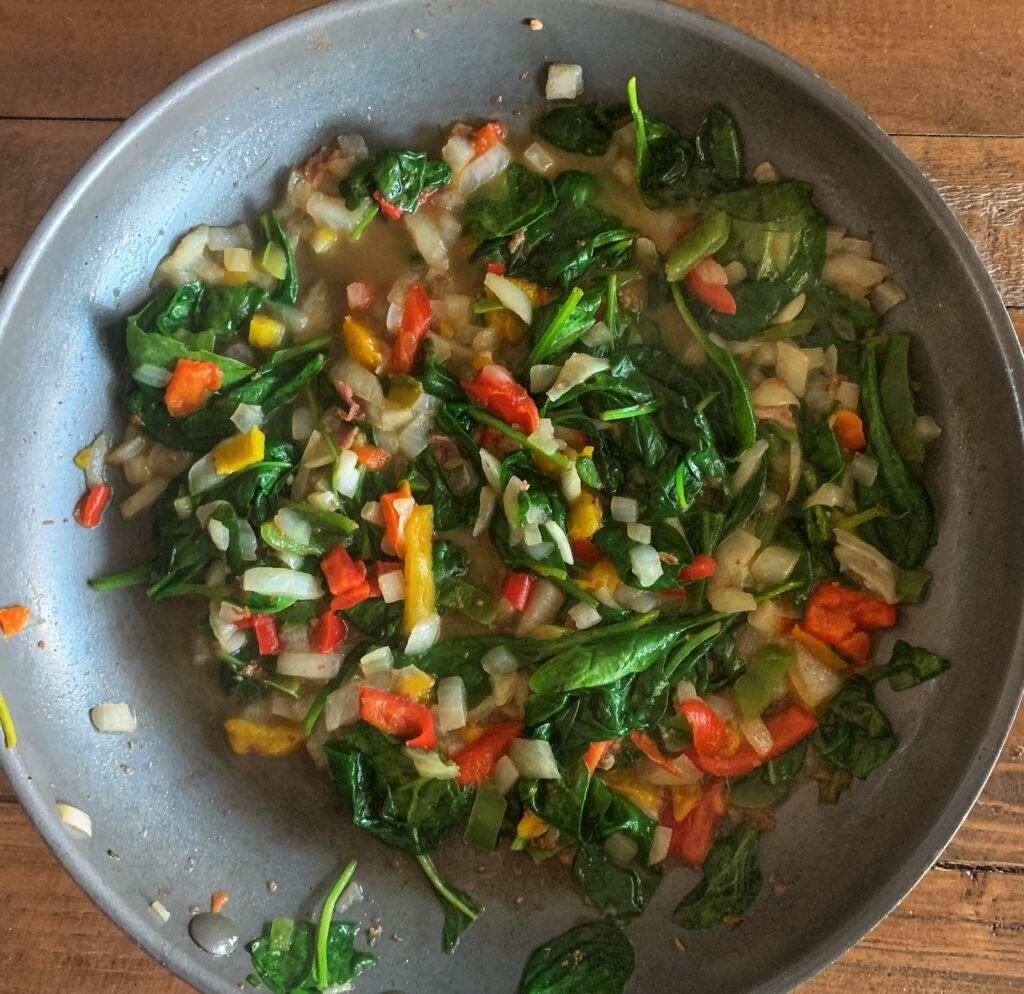 veggies sauteeing in skillet