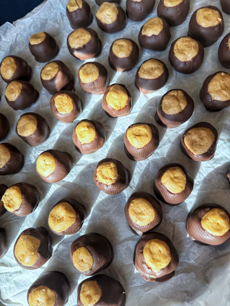 finished buckeyes on cookie sheet