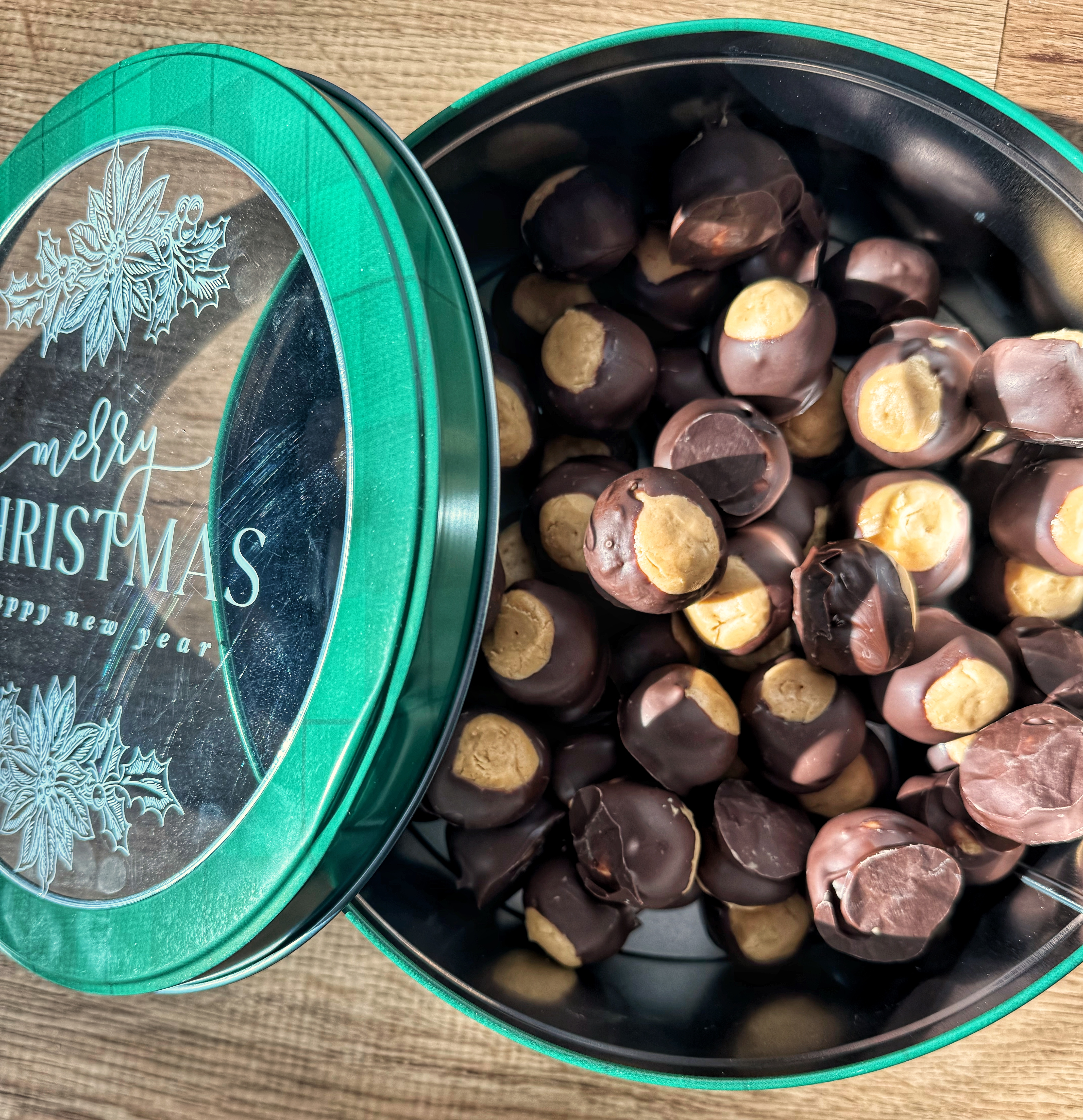 buckeyes in green christmas treat tin