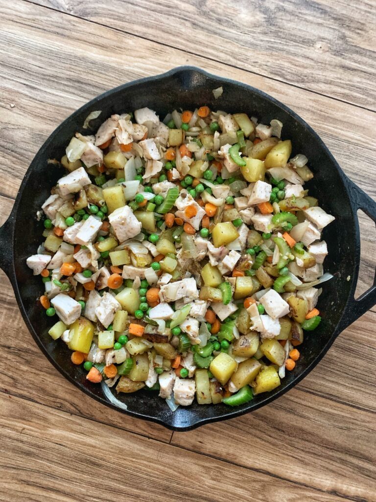 cooked veggie mixture in cast iron