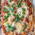 pizza topped with basil